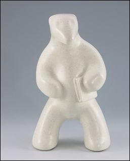 Image of standing polar bear sculpture in carrara white holding a book, portrait facing the viewer.