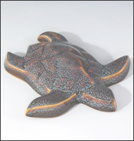 Image of Baby Sea Turtle sculpture in starfield blue glaze, seen  from above, facing to the viewers lower right.