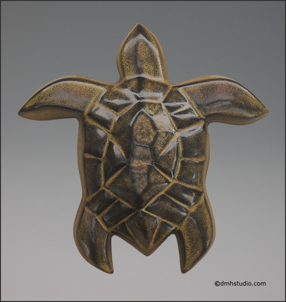 Large image of Hanalei Sea Turtle sculpture in black gold glaze, portrait.