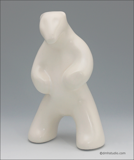Large image of standing white polar bear sculpture, portrait facing out toward the viewer.