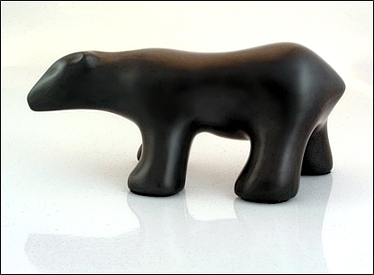 Image of walking polar bear sculpture in diamond black, profile facing the viewers left.