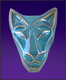 Image of brother cat mask in floating waterfall blue. Portrait facing the viewer.