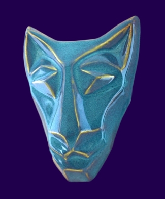 Image of Brother cat mask in floating waterfall blue glaze. Portrait facing slightly to the viewers left.