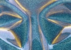 Image of Brother cat mask, close-up of the glaze around the eyes.