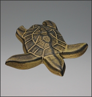 Image of Hanalei Sea Turtle sculpture in black gold glaze, seen  from slightly above, and facing to the viewers right.